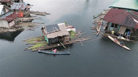 the floods have made the village inaccessible|Floating bamboo houses keep this indigenous tribe safe in a .